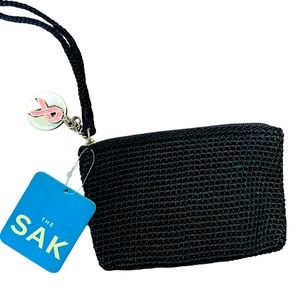 NWT The SAK black crocheted wristlet with breast, cancer awareness, zipper pin